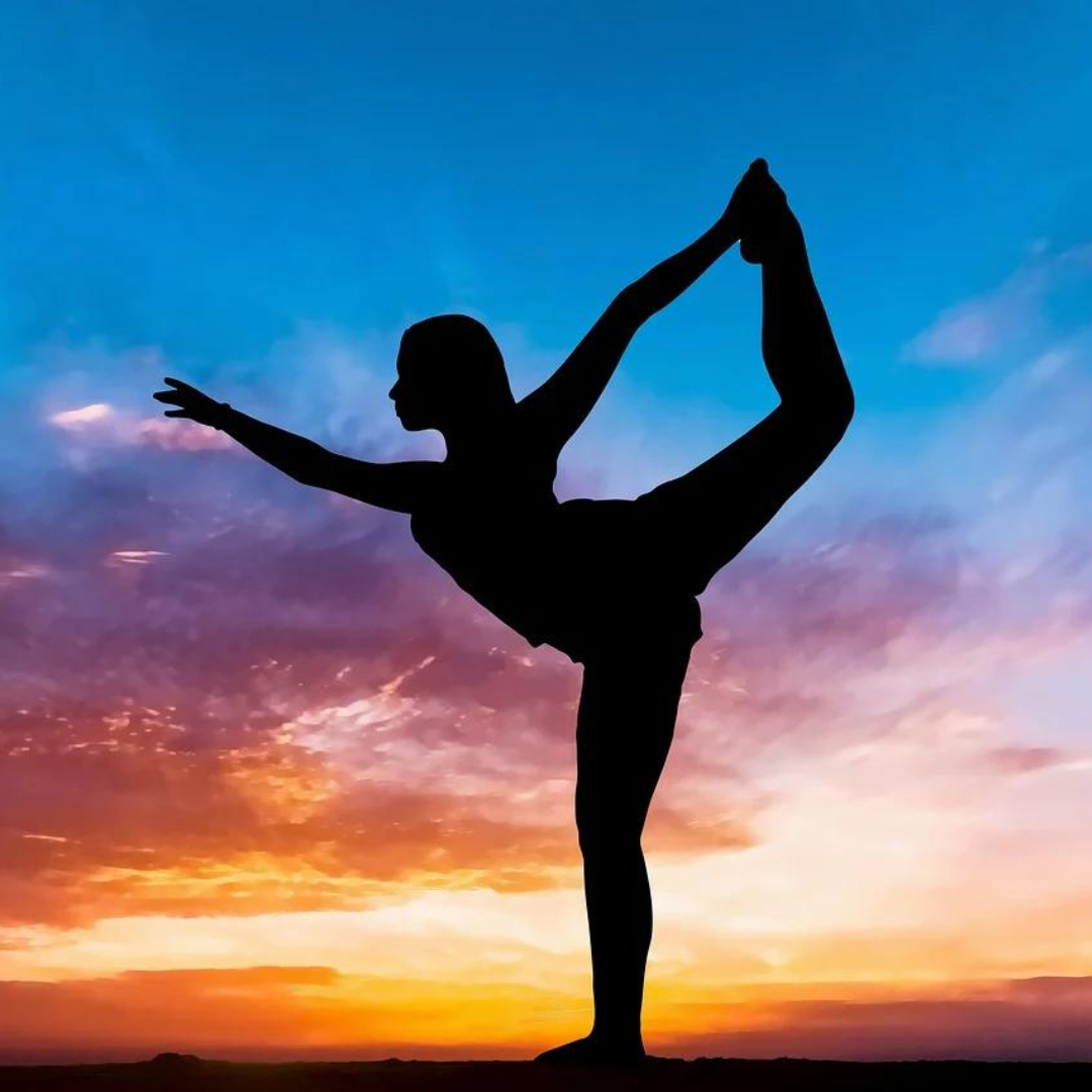 Silhouette of Woman Doing Yoga at the Beach